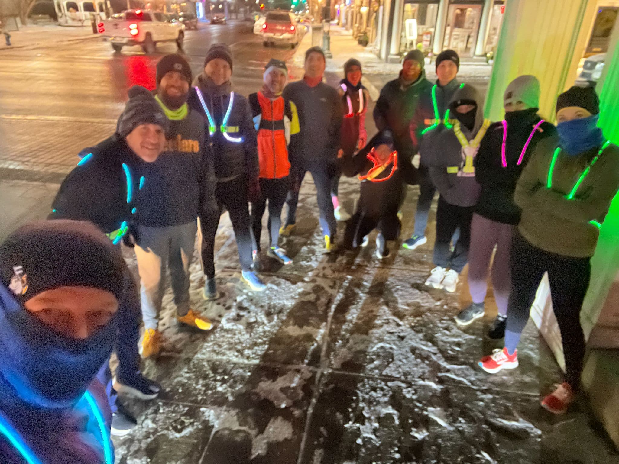 Sewickley Run Club members in reflective gear on a snowy Tuesday night run